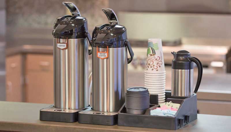 Commercial coffee equipment in a workplace breakroom