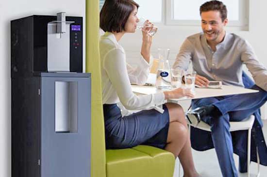 Bottleless office water cooler in a workplace breakroom